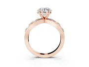 Round Cut Diamond Solitaire Ring Set in Rose gold with Side Stones on Criss-Cross Band and Prong Setting