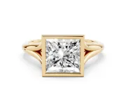 Bezel Set Princess Cut Diamond Solitaire Ring Set in Yellow gold with Tapered Band
