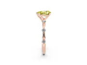 Fancy Yellow Pear Cut Diamond Solitaire Ring Set in Rose gold with Bezel Set Side Stones and Prong Setting
