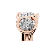Round Cut Diamond Three-Stone Wave Ring Set in Rose gold with Bezel Setting