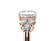 Princess Cut Diamond Cluster Ring Set in Rose gold with Round Accent Stones and Prong Setting on a Plain Band