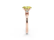 Fancy Yellow Three-Stone Oval Cut Diamond Ring Set in Rose gold with Prong Setting and Plain Band