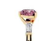 Fancy Pink Heart Cut Diamond Solitaire Ring Set in Yellow gold with Tapered Baguette Side Stones and Prong Setting