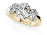 Three-Stone Oval Cut Diamond Ring Set in Yellow gold with Matching Prong Settings and Plain Band