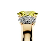 Fancy Yellow Three-Stone Oval Cut Diamond Ring Set in Yellow gold with Matching Prong Settings and Plain Band