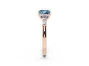 Fancy Blue Princess Cut Diamond Solitaire Ring Set in Rose gold with Tapered Baguette Side Stones and Prong Setting