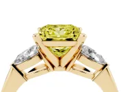 Fancy Yellow Three-Stone Princess Cut Diamond Ring Set in Yellow gold with Pear Side Stones and Prong Setting