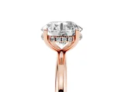 Round Cut Diamond Solitaire Engagement Ring Set in Rose gold with Prong Setting and Polished Band