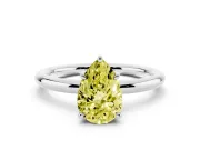 Fancy Yellow Pear Cut Diamond Solitaire Ring Set in Platinum with Thin Band and Prong Setting