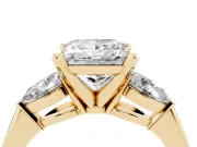 Three-Stone Princess Cut Diamond Ring Set in Yellow gold with Pear Side Stones and Prong Setting