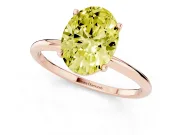 Fancy Yellow Oval Cut Diamond Solitaire Engagement Ring Set in Rose gold with Thin Band and Prong Setting