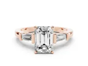 Emerald Cut Diamond Solitaire Ring Set in Rose gold with Tapered Baguette Accents and Prong Setting