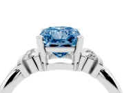 Fancy Blue Three-Stone Radiant Cut Diamond Channel Set Ring Set in White gold with Bar Prongs