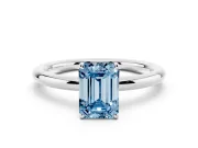 Fancy Blue Emerald Cut Diamond Solitaire Ring Set in White gold with Prong Setting on a Polished Plain Band