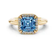 Fancy Blue Asscher Cut Diamond Halo Engagement Ring Set in Yellow gold with Plain Split Shank and Prong Setting