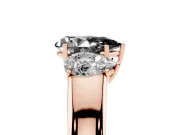 Fancy Black Three-Stone Pear Cut Diamond Ring Set in Rose gold with Matching Prong Settings and Plain Band
