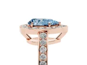 Fancy Blue Pear Cut Diamond Halo Pavé Engagement Ring Set in Rose gold with Bezel Setting