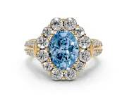 Fancy Blue Oval Cut Diamond Halo Engagement Ring Set in Yellow gold with Split Shank and Prong Setting