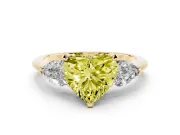 Fancy Yellow Three-Stone Heart Cut Diamond Ring Set in Yellow gold with Pear Side Stones and Prong Setting