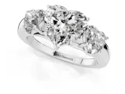 Heart Cut Diamond Three-Stone Ring Set in Platinum with Bold Center and Classic Band