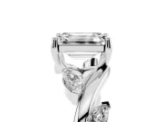 Emerald Cut Diamond Solitaire Ring Set in Platinum with Twisted Marquise Accent Band