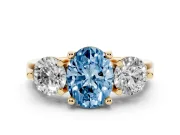 Fancy Blue Oval Cut Diamond Three-Stone Ring Set in Yellow gold with Prong Setting and Classic Band