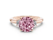 Fancy Pink Three-Stone Round Cut Diamond Ring Set in Rose gold with Prong Setting and Plain Band