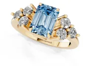 Fancy Blue Emerald Cut Diamond Solitaire Ring Set in Yellow gold with Cluster Accents on Each Side