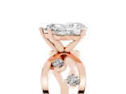 Pear Cut Diamond Solitaire Ring Set in Rose gold with Side Stones on Criss-Cross Band and Prong Setting