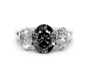 Fancy Black Oval Cut Diamond Three-Stone Ring Set in White gold with Bold Center and Classic Band