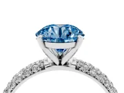 Fancy Blue Round Cut Diamond Solitaire Ring Set in White gold with Prong Setting and Pavé-Set Band