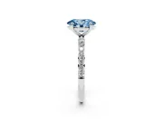 Fancy Blue Oval Cut Diamond Solitaire Ring Set in Silver with Round Pavé Band and Prong Setting