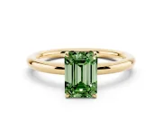 Fancy Green Emerald Cut Diamond Solitaire Ring Set in Yellow gold with Prong Setting on a Polished Plain Band