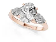 Three-Stone Oval Cut Diamond Ring Set in Rose gold with Pear Side Stones and Prong Setting