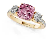 Fancy Pink Cushion Cut Diamond Three-Stone Ring Set in Yellow gold with Round Side Stones and Delicate Pavé Band