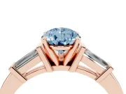 Fancy Blue Pear Cut Diamond Solitaire Ring Set in Rose gold with Tapered Baguette Accents and Prong Setting