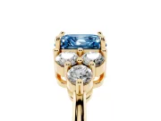 Fancy Blue Asscher Cut Diamond Solitaire Ring Set in Yellow gold with Cluster Accents on Each Side