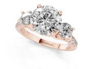Three-Stone Round Cut Diamond Pavé Band Ring Set in Rose gold with Prong-Set Trio