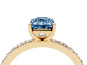 Fancy Blue Emerald Cut Diamond Solitaire Set in Yellow gold with Round Pavé Band and Prong Setting