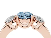 Fancy Blue Oval Cut Diamond Three-Stone Ring Set in Rose gold with Polished Band and Prong Setting