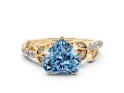 Fancy Blue Heart Cut Diamond Solitaire Leaf-Inspired Ring Set in Yellow gold with Pavé Band and Prong Setting