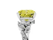 Fancy Yellow Radiant Cut Diamond Solitaire Ring Set in White gold with Marquise Twist Band and Prong Setting