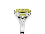 Fancy Yellow Emerald Cut Diamond Solitaire Ring Set in Platinum with Polished Tapered Band and Prong Setting