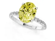 Fancy Yellow Oval Cut Diamond Solitaire Ring Set in Platinum with Round Pavé Band and Prong Setting