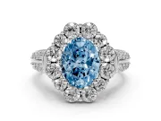 Fancy Blue Oval Cut Diamond Halo Engagement Ring Set in Platinum with Split Shank and Prong Setting