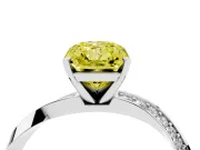 Fancy Yellow Radiant Cut Diamond Engagement Ring Set in Platinum with Side Stone Accents and Prong Setting