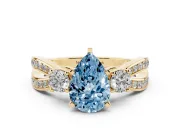 Pear-Shaped Three-Stone Twist Engagement Ring Setting for a Fancy Blue Lab-Grown Diamond | Yellow Gold