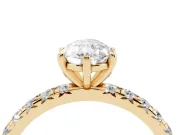 Pear Cut Diamond Pavé Solitaire Ring Set in Yellow gold with Round Band and Prong Setting