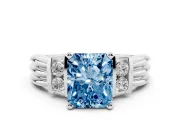 Fancy Blue Three-Stone Radiant Cut Diamond Channel Set Ring Set in White gold with Bar Prongs