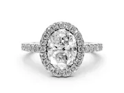 Oval Cut Diamond Halo Pavé Solitaire Ring Set in Silver with Prong-Set Center Stone